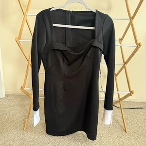 Elegant Black Dress with White Cuffs